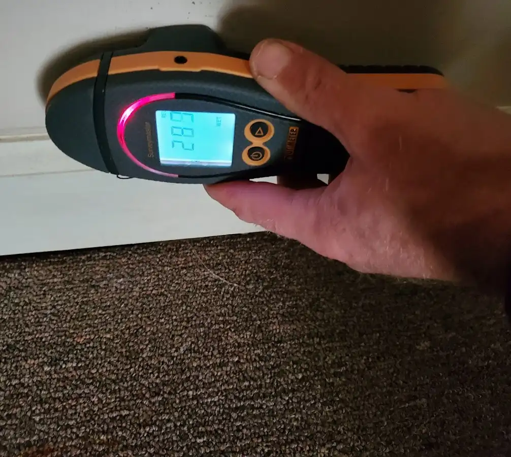 Moisture detection at baseboard during Storm Damage Restoration in Bridgewater